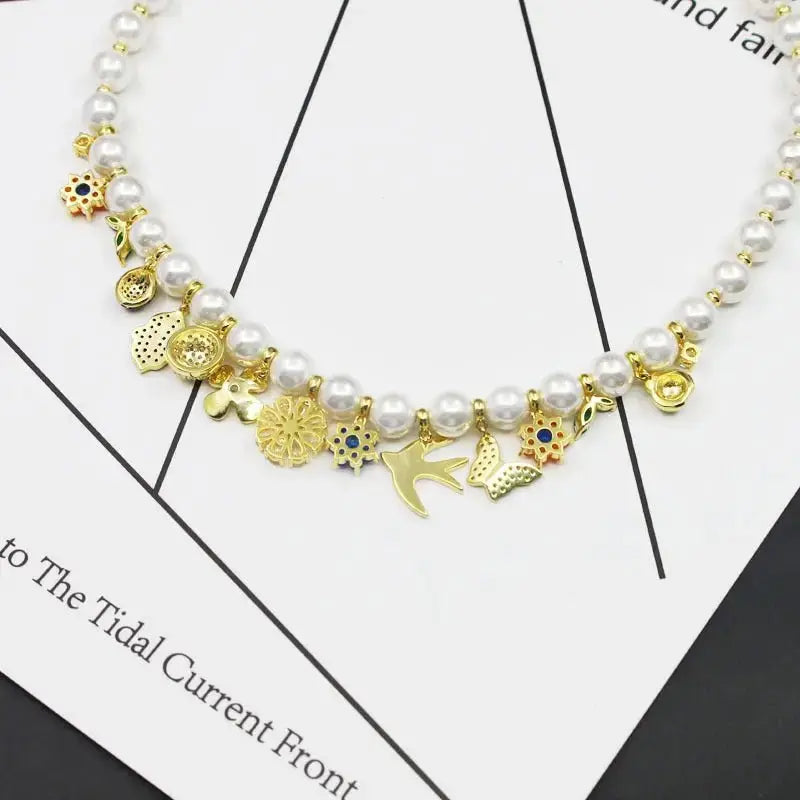 Fashionable retro style jewelry garden necklace women's jewelry flower pendant swallow beetle buckle pearl collarbone chain - FluxDigital